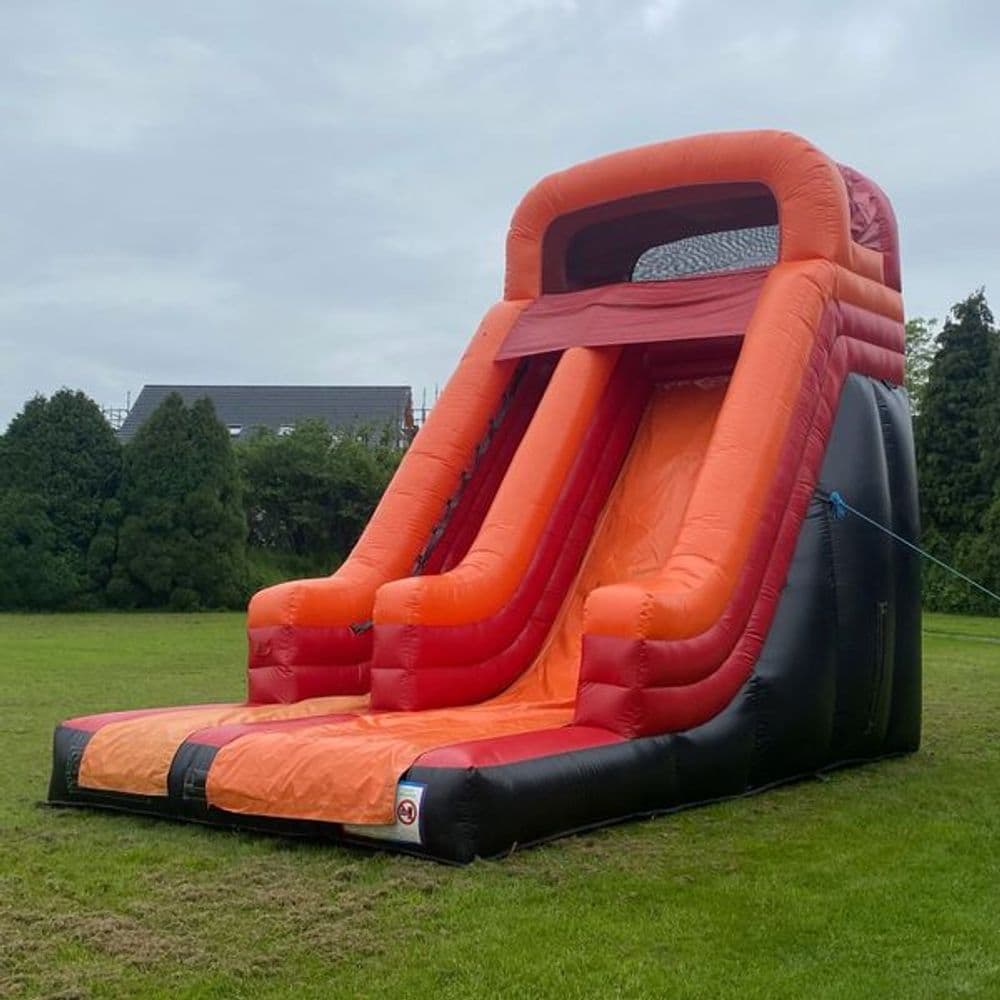 Castle Pink bouncy castle with pastel turrets, sized for younger children at a small birthday party.